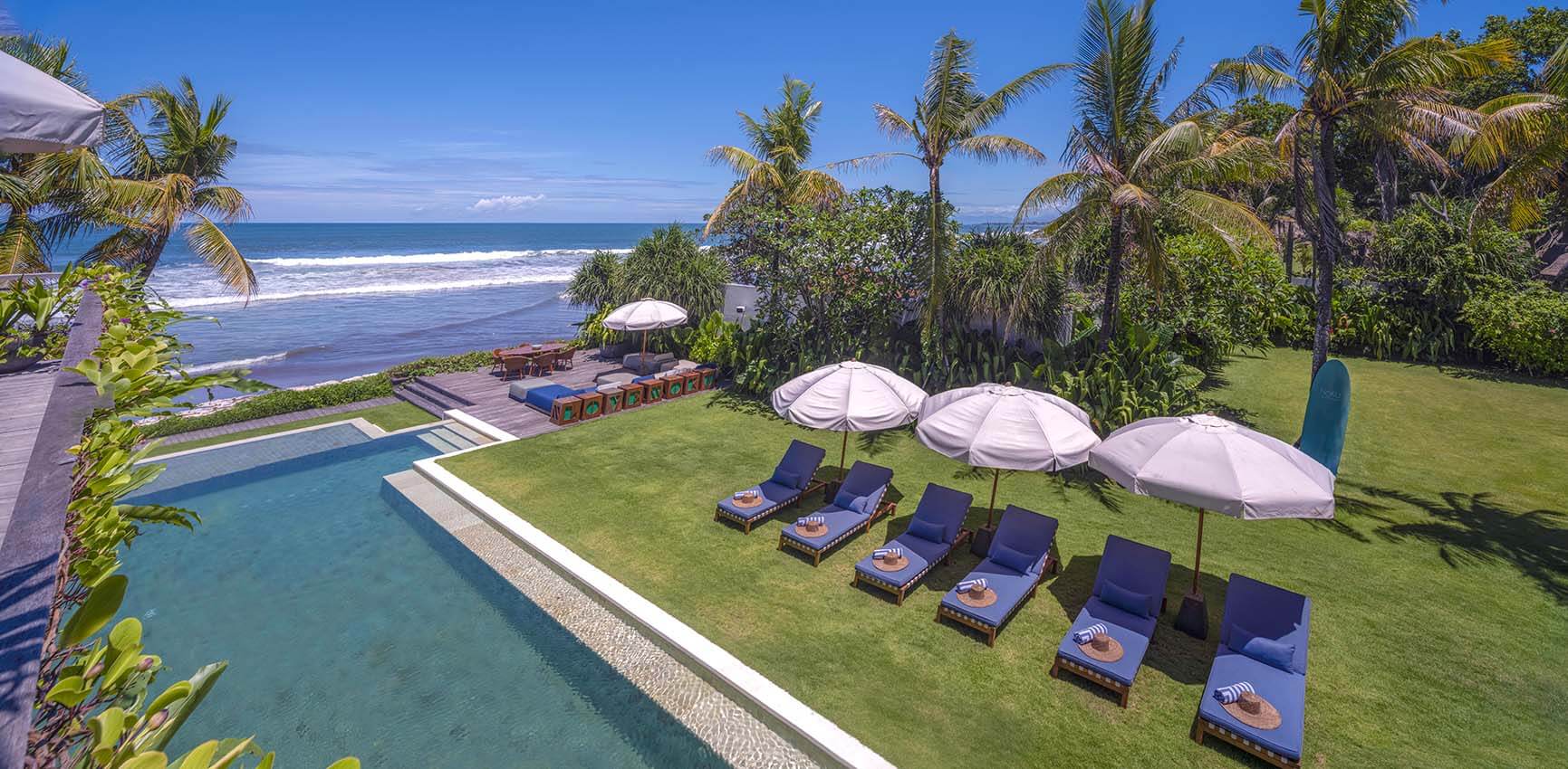 Noku Beach House - pool and lawn